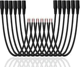 Set of black cables with connectors on a white background