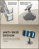 Phone holder with scratch-proof silicone hook, stable base with silicone grip, and anti-skid design on a beige background.