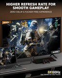 Gaming setup with a monitor and laptop displaying a high refresh rate game scene.