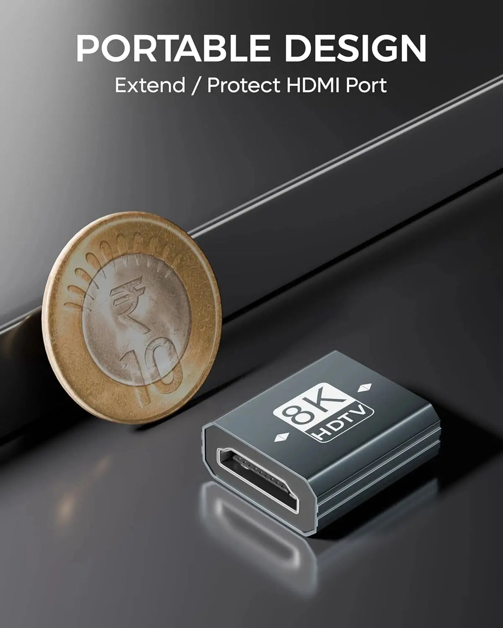 Small HDMI extension or protection device next to a coin on a reflective surface