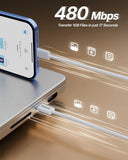 Phone connected to a laptop with a cable, showcasing data transfer speed on a brown background.