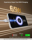 Phone with charging cable displaying 65W charging speed on a brown background